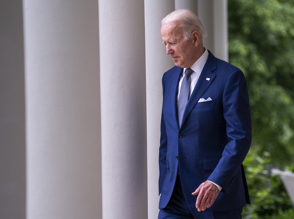 epaselect epa09945704 US President Joe Biden walks into the Rose Garden to deliver remarks at the White House in Washington, DC, USA 13 May 2022. President Biden&#039;s remarks addressed state and loc ...