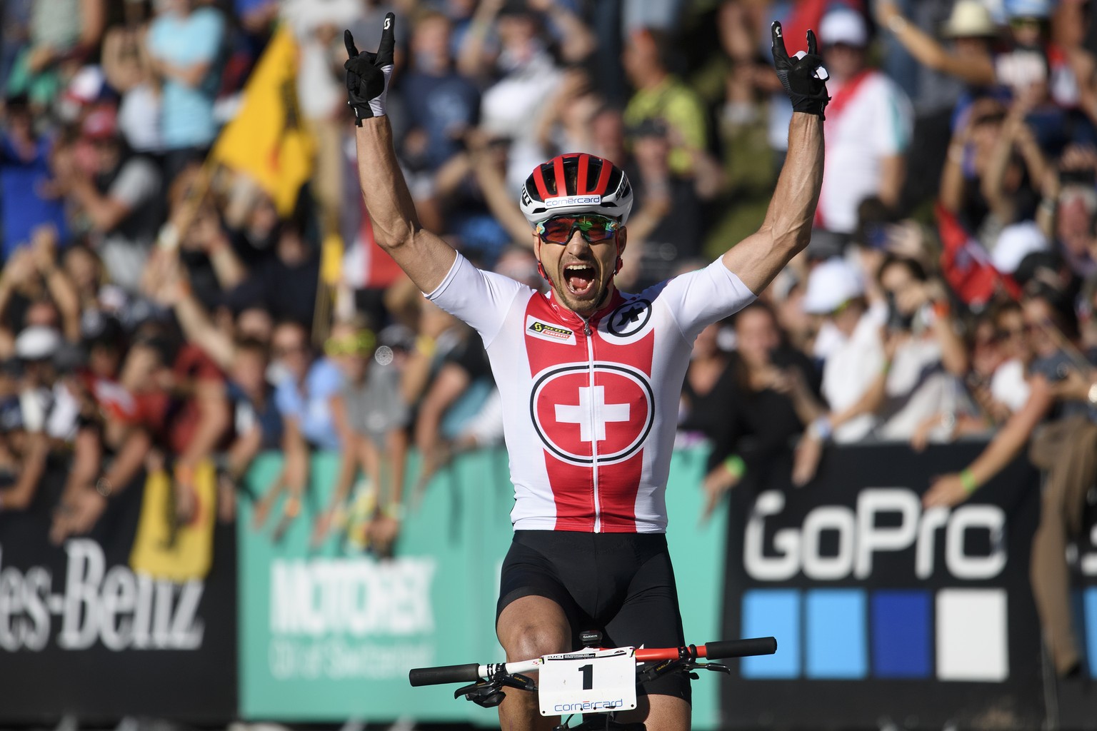 Winner Nino Schurter of Switzerland reacts during the men&#039;s elite cross country olympic race at the UCI mountain bike world championships, on Saturday, September 8, 2018, in Lenzerheide, Switzerl ...