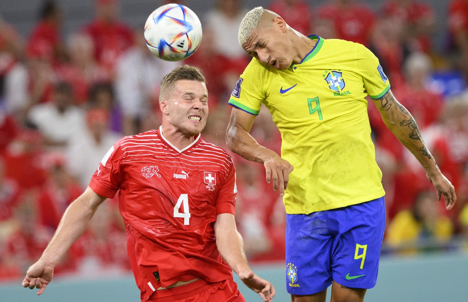 Switzerland&#039;s defender Nico Elvedi, left, fights for the ball with Brazil&#039;s forward Richarlison, right, during the FIFA World Cup Qatar 2022 group G soccer match between Brazil and Switzerla ...