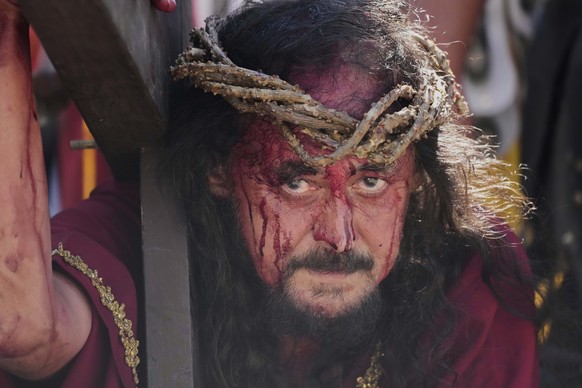 A performer reenacts the crucifixion of Jesus Christ to mark Maundy Thursday in Paete town, Laguna province, Philippines, April 17, 2025. (AP Photo/Aaron Favila)
Philippines Holy Week Photo Gallery