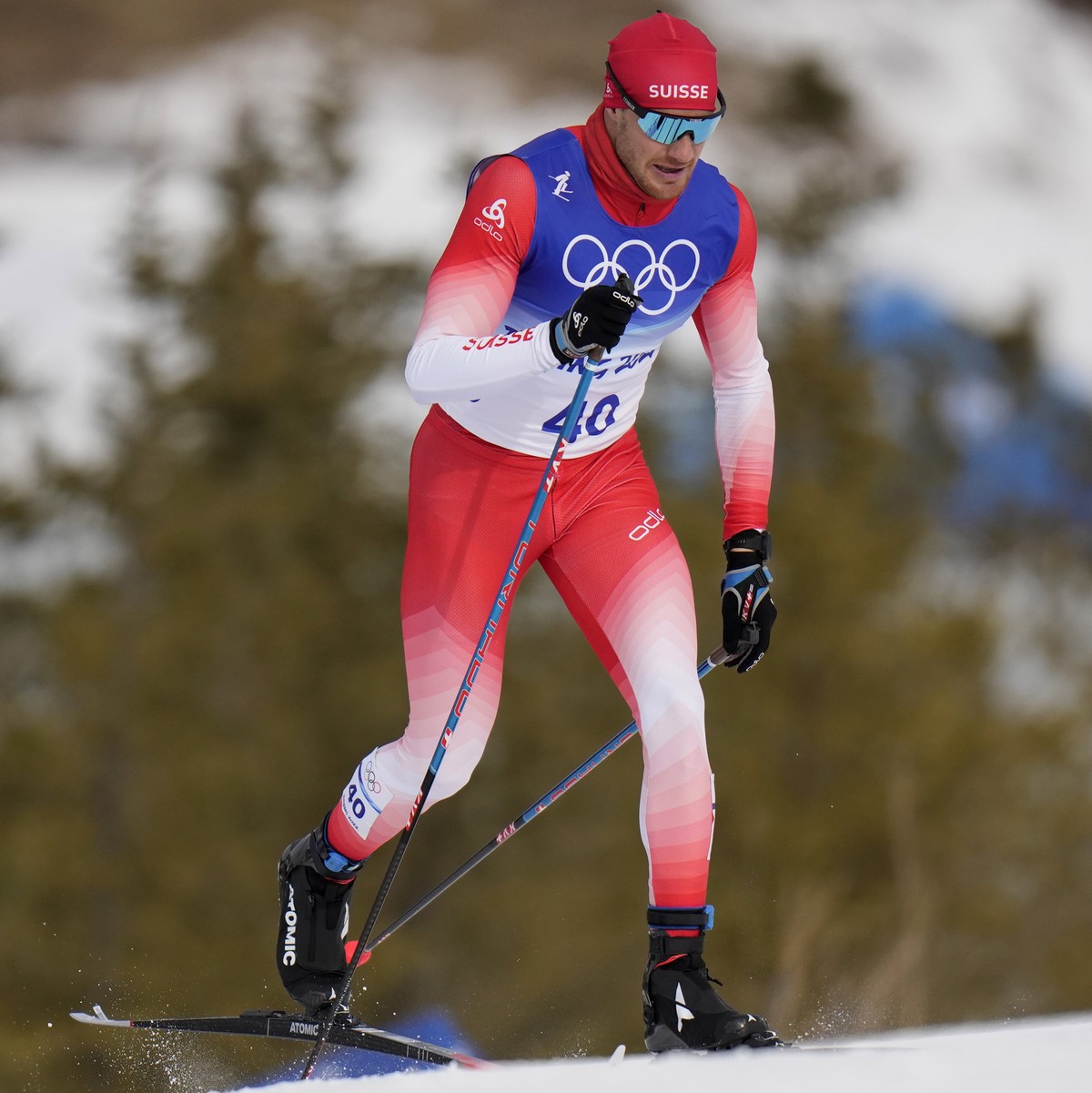 Dario Cologna, of Switzerland, competes during the men's 15km classic cross-country skiing competition at the 2022 Winter Olympics, Friday, Feb. 11, 2022, in Zhangjiakou, China. (AP Photo/Alessan ...