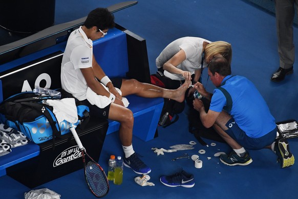 epa06475086 Hyeon Chung of South Korea receives treatment as he plays Roger Federer of Switzerland during the mens semifinal on day twelve of the Australian Open tennis tournament, in Melbourne, Austr ...