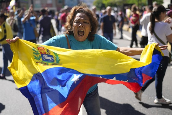 Opponents of Venezuelan President Nicolas Maduro protest the day before his inauguration for a third term in Caracas, Venezuela, Thursday, Jan. 9, 2025. (AP Photo/Matias Delacroix)