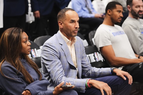 Nico Harrison, center, the Dallas Mavericks general manager watches warmups before an NBA basketball game against the Los Angeles Lakers in Dallas, Wednesday, April 9, 2025. (AP Photo/LM Otero)
Nico H ...