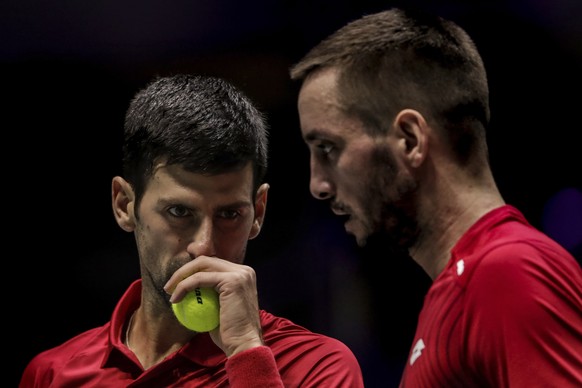 FILE - In this Nov. 22, 2019, file photo, Serbia&#039;s Novak Djokovic, left, and teammate Viktor Troicki play against Russia&#039;s Karen Khachanov and Andrey Rublev during the Davis Cup quarterfinal ...