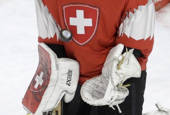 Switzerland&#039;s goalie Leonardo Genoni makes a save during the Ice Hockey World Championships final match between Sweden and Switzerland at the Royal arena in Copenhagen, Denmark, Sunday, May 20, 2 ...