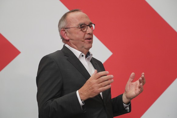 epa09490233 SPD co-leader Norbert Walter-Borjans on stage during the Social Democratic Party (SPD) election event in Berlin, Germany, 26 September 2021. About 60 million Germans were eligible to vote  ...