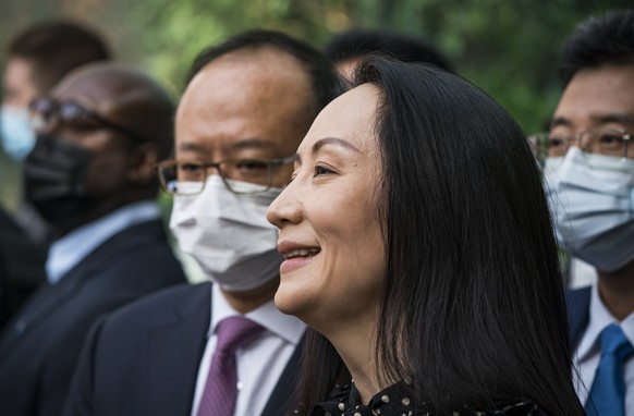 epa09486584 Meng Wanzhou leaves British Columbia Supreme Court and speaks to the media in Vancouver, British Columbia, Canada 24 September 2021. Meng is reportedly appearing virtually in US court from ...