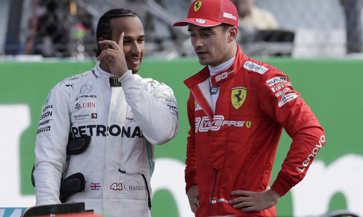 Ferrari driver Charles Leclerc of Monaco, right, talks with Mercedes driver Lewis Hamilton of Britain after the qualifying session at the Monza racetrack, in Monza, Italy, Saturday, Sept. 7, 2019. The ...