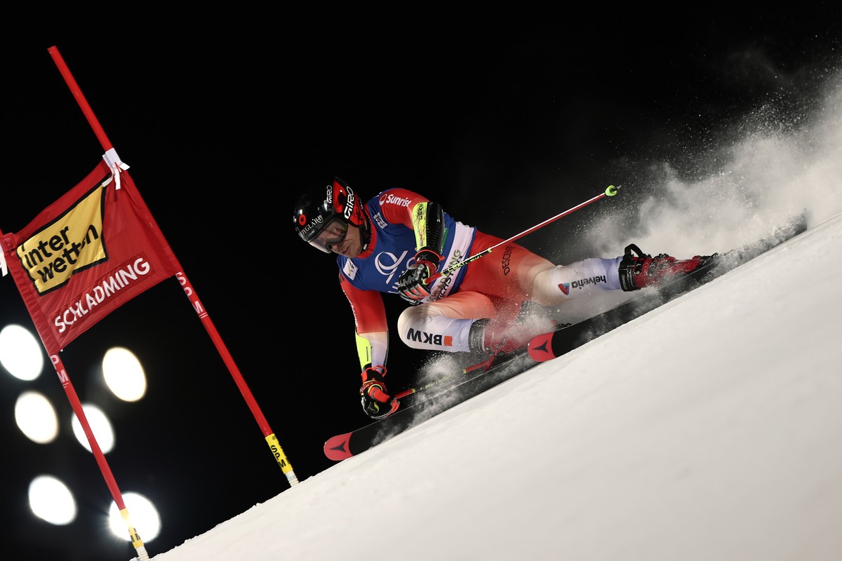 Switzerland's Gino Caviezel speeds down the course during an alpine ski, men's World Cup giant slalom in Schladming, Austria, Tuesday, Jan. 27, 2026. (AP Photo/Gabriele Facciotti)
Gino Cavie ...