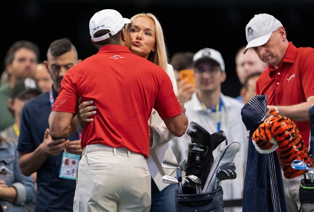 Tiger Woods of Jupiter Links GC gets a hug and kiss from Vanessa Trump before match against Los Angeles Golf Club during the TGL finals at SoFi Center on March 24, 2026, in Palm Beach Gardens, Florida ...