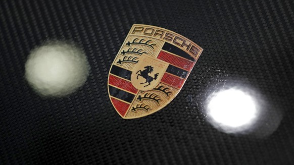 epa06607488 A Porsche Logo on a bonnet of a Porsche sports car prior to the annual results press conference of Porsche AG in Stuttgart, Germany, 16 March 2018. Porsche AG during the conference will pr ...