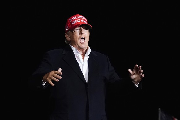Former President Donald Trump reacts to the crowd as he arrives to speak at a Save America Rally Saturday, Jan. 15, 2022, in Florence, Ariz. (AP Photo/Ross D. Franklin)