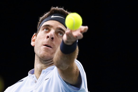 Juan Martin Del Potro of Argentina serves the ball to John Isner of the United States during their quarter-final match of the Paris Masters tennis tournament at the Bercy Arena in Paris, France, Frida ...