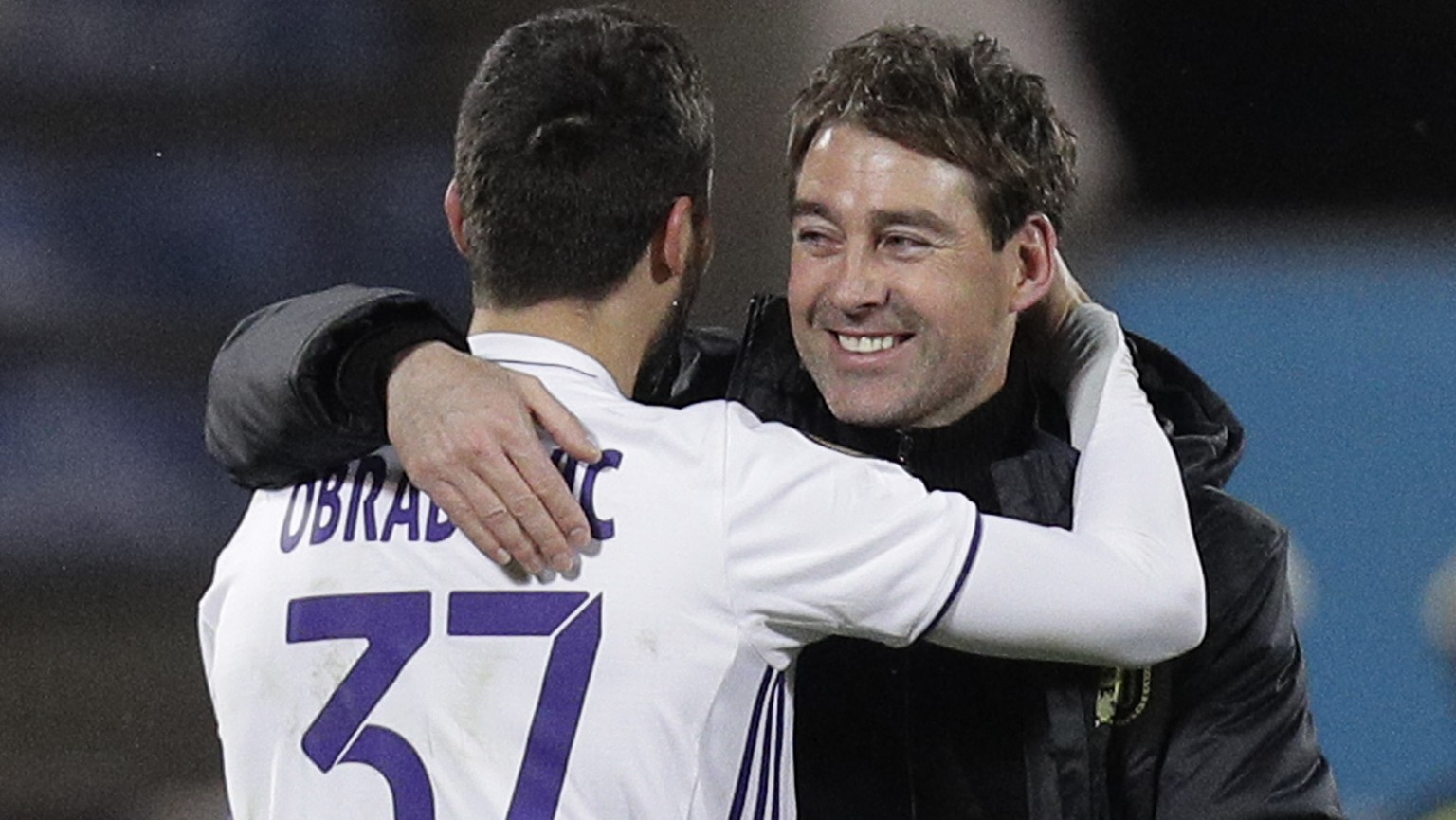 Anderlecht&#039;s Ivan Obradovic, left, and head coach Rene Weiler celebrate after victory of their team during a Europa League round of 32 second leg soccer match between Zenit St.Petersburg and Ande ...