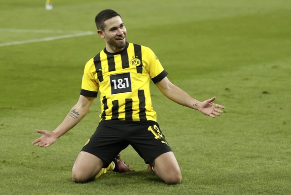 epa10515748 Dortmund&#039;s Raphael Guerreiro celebrates after scoring the 2-1 lead during the German Bundesliga soccer match between FC Schalke 04 and Borussia Dortmund in Gelsenkirchen, Germany, 11 ...