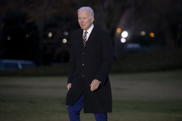 epa10441887 US President Joe Biden walks across the South Lawn of the White House after returning by Marine One, in Washington, DC, USA, 31 January 2023. Biden returns from a daytrip to New York City. ...