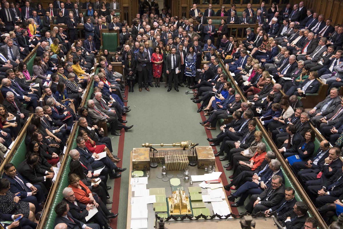Lawmakers in the House of Commons, London, with Britain's Prime Minister Theresa May at center right front row, Tuesday March 12, 2019. With just 17 days to go, Britain's departure from the  ...