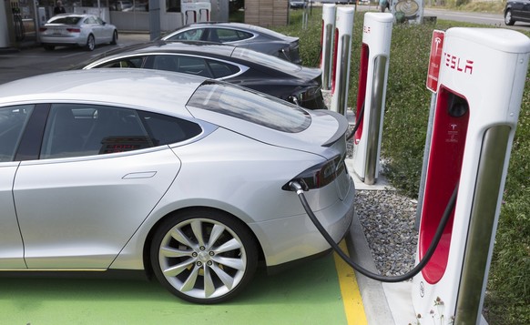 A Tesla model S 85D at a high-powered supercharger station in Dietlikon, Switzerland, on August 17, 2016. Tesla manufactures equipment has installed a network of superchargers across North America, Eu ...