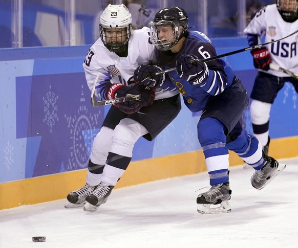 epa06514304 Jenni Hiirikoski (R) of Finland in action against Dani Cameranesi (L) of USA during the women's Ice Hockey match between Finland and USA at the Kwandong Hockey Centre during the PyeongChang Winter Olympic Games 2018, in Gangneung, South Korea, 11 February 2018. The PyeongChang 2018 Winter Olympic Games, will run from 09 to 25 February 2018.  EPA/SRDJAN SUKI