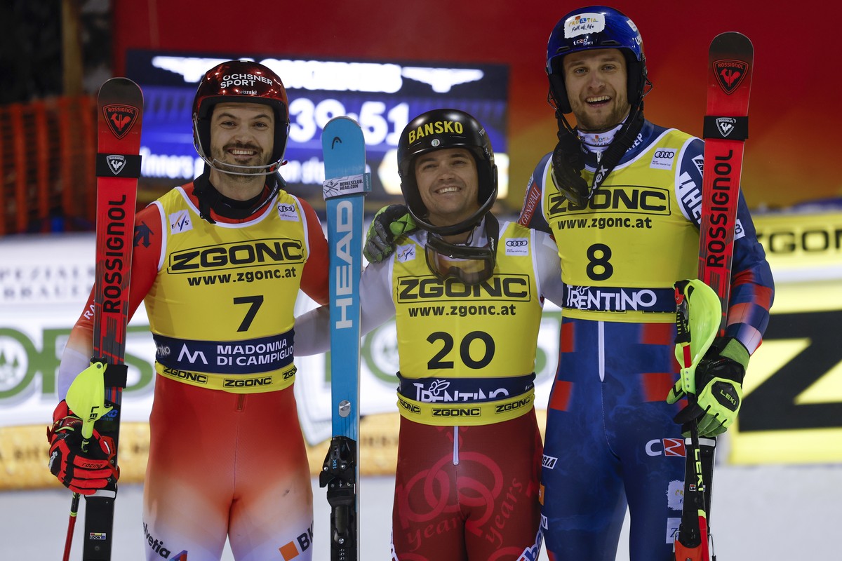 Bulgaria's Albert Popov, center, winner of an alpine ski, men's World Cup slalom, poses with second placed Switzerland's Loic Meillard, left, and third placed Croatia's Samuel Kole ...