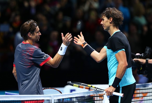 LONDON, ENGLAND - NOVEMBER 20: (R-L) The victorious Rafael Nadal of Spain shakes hands with David Ferrer of Spain following his victory during their men&#039;s singles match on day six of the Barclays ...