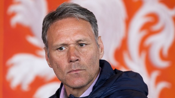 FILE - In this Friday, May 20, 2016 file photo, Dutch former soccer star Marco van Basten is seated in front of the logo of the Dutch soccer association KNVB during a presentation of video referee ass ...