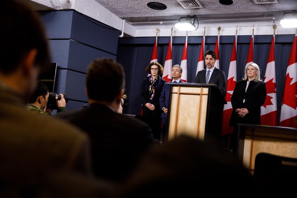 epa08120617 Handout image released by the office of the Prime Minister showing Canadian Prime Minister Trudeau (C) with Canadian Foreign Minister FranÃ§ois-Philippe Champagne (2L) and Senior Associate ...