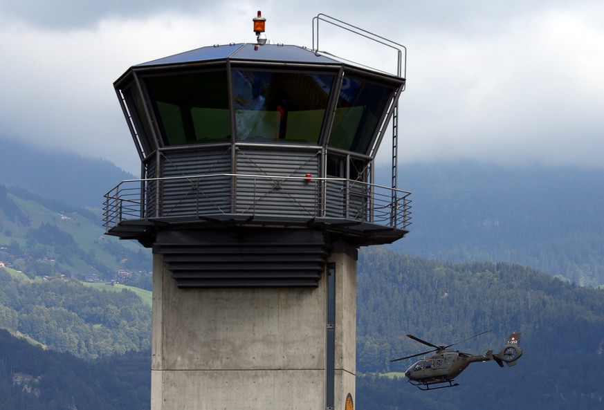 A Swiss Army Airforce helicopter take off next to the tower at the military airport in Meiringen, Switzerland August 30, 2016. REUTERS/Ruben Sprich