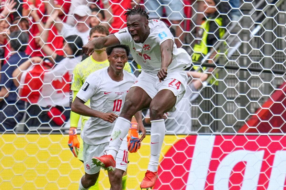 Canada's Promise David (24) celebrates after scoring during the World Cup Group B soccer match between Switzerland and Canada in Vancouver, British Columbia, Wednesday, June 24, 2026. (AP Photo/A ...