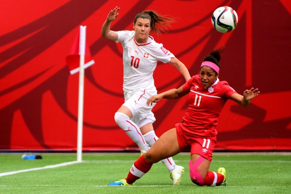 Jun 21, 2015; Vancouver, British Columbia, CAN; Switzerland forward Ramona Bachmann (10) and Canada midfielder Desiree Scott (11) battle for control of the ball near the goal in the first half of a ga ...