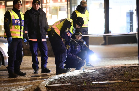 epa09049639 Police technicians on the scene of an attack in central Vetlanda, Sweden, 03 March 2021. Eight people have reportedly been left injured in an attack in southern Sweden described by police  ...