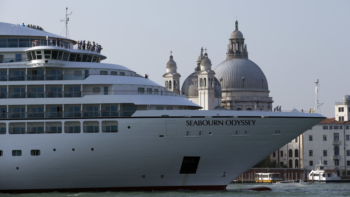 FILE-- In this Sept. 27, 2014 file photo a cruise ship transits in the Giudecca canal in front of St. Mark's Square, in Venice, Italy. Declaring Venice's waterways a