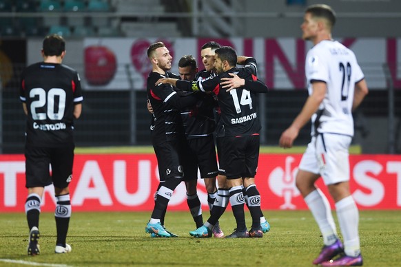 in the center, Lugano&#039;s player Celar Zan celebratess with teammate the 1-0 goal during the Super League soccer match FC Lugano against SFC Servette, at the Cornaredo Stadium in Lugano, Saturday,  ...