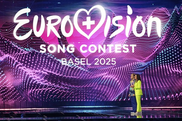 Hosts Hazel Brugger, left and Sandra Studer, on stage during the first semi-final of the 69th Eurovision Song Contest, in Basel, Switzerland, Tuesday, May 13, 2025. (AP Photo/Martin Meissner)
Switzerl ...