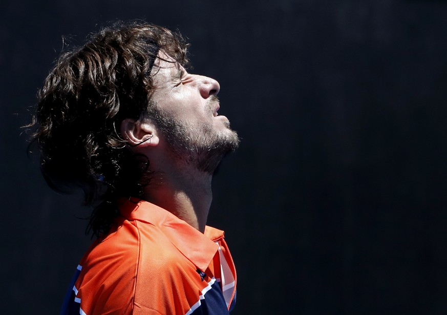 Spain's Feliciano Lopez grimaces while playing United States' Sam Querrey during their first round match at the Australian Open tennis championships in Melbourne, Australia, Tuesday, Jan. 16, 2018. (A ...