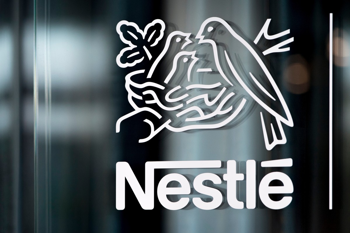 FILE - In this Thursday, Feb. 14, 2019, file photo, Nestle's logo is displayed on a window, during the 2018 full-year results press conference of the food and drinks giant Nestle, in Vevey. (Laur ...