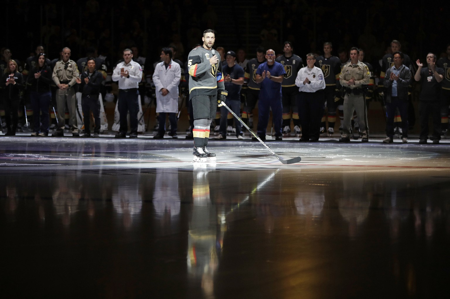 Vegas Golden Knights defenseman Deryk Engelland speaks during a ceremony to honor the first responders of the shooting in Las Vegas before an NHL hockey game Tuesday, Oct. 10, 2017, in Las Vegas. (AP  ...