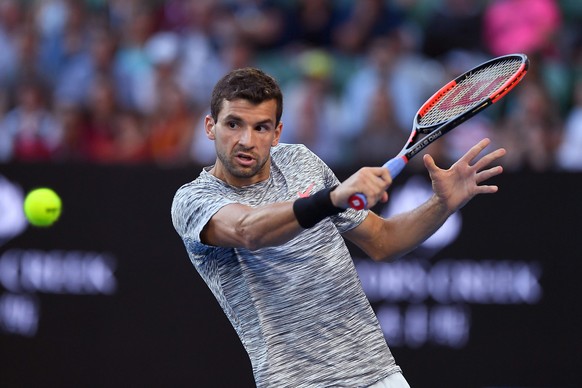 epa05753553 Grigor Dimitrov of Bulgaria in action during the Men&#039;s Singles semifinal match against Rafael Nadal of Spain at the Australian Open Grand Slam tennis tournament in Melbourne, Australi ...