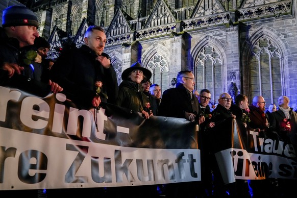 Co leader of German far right party AfD Alice Weidel, 3rd from left, attends an AfD election campaign in front of the cathedral in Magdeburg, Germany, Monday, Dec. 23, 2024. (AP Photo/Ebrahim Noroozi)