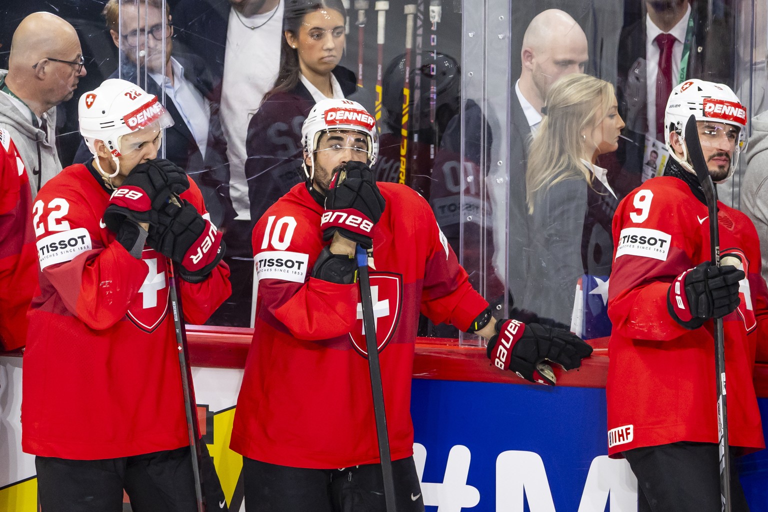 epa12135688 Switerland's players with Nino Niederreiter, Andres Ambuehl and Damien Riat, react after the victory of the team USA in the IIHF Ice Hockey World Championship final match between Swit ...