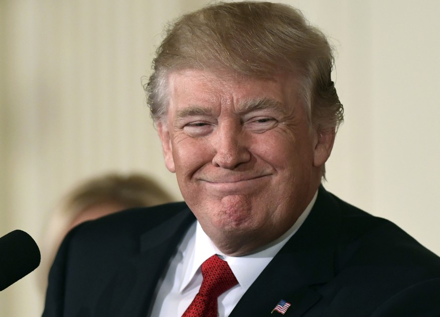 President Donald Trump smiles as he announces in the East Room of the White House in Washington, Thursday, Oct. 12, 2017, that Kirstjen Nielsen, a cybersecurity expert and deputy White House chief of  ...