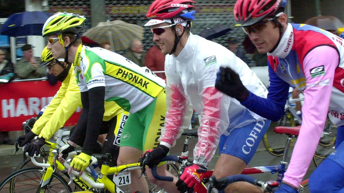 Switzerland's Jean Nuttli, second left (Phonak), Belgium's Nico Mattan, center, and Scotland's David Millar pedal at the start of the Paris-Nice cycling race first stage, Monday March 1 ...