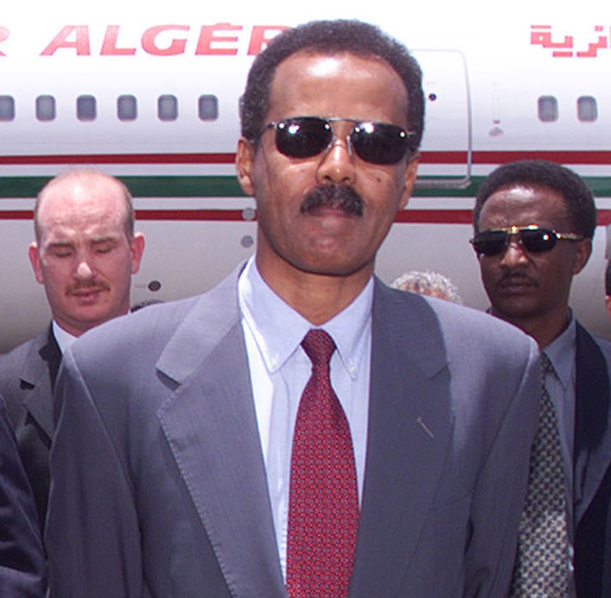 Eritrean President Isaias Afewerki, right, walks with Algerian President and current Chairman of the Organization of the African Unity (OAU) Abdelazziz Bouteflika, at Asmara airport Thursday, May 25,  ...