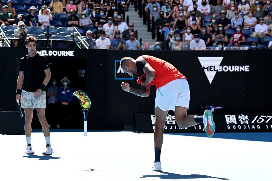 epa09711509 Nick Kyrgios (R) of Australia smashes his racquet during his doubles semi final with compatriot Thanasi Kokkinakis against Marcel Granollers of Spain and Horacio Zeballos of Argentina at t ...