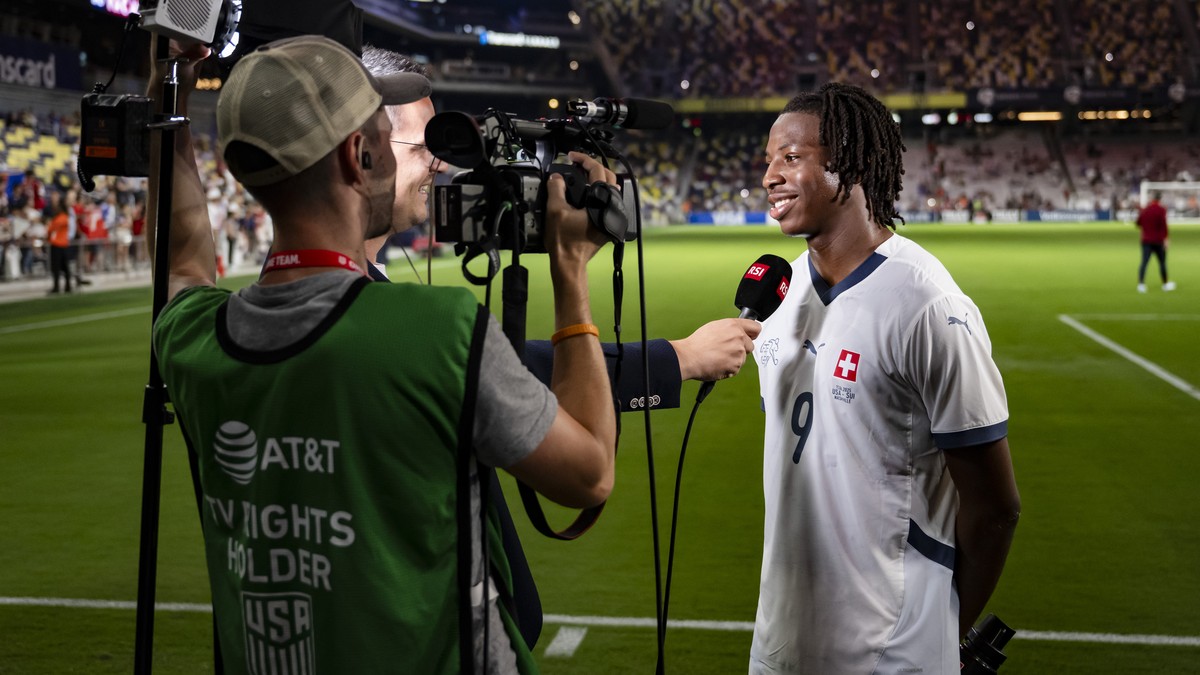 Switzerland's Johan Manzambi talking on RSI TV during a Friendly soccer match between USA and Switzerland at the Geodis Park stadium, in Nashville, Tennessee, United States of America, Wednesday, ...