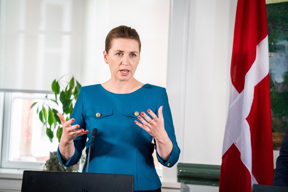 epa10004482 Danish Prime Minister Mette Frederiksen holds a press conference with Faroese Lagman B�r�ur � Steig Nielsen (not seen) and the chairman of the Greenlandic government, M�te Bourup Egede (no ...