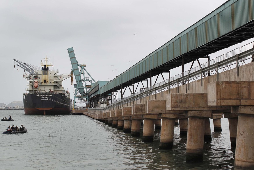 A new conveyor transports mineral concentrate onto a ship during the opening ceremony of a mineral concentrate terminal at the port of Callao, in Lima May 29, 2014. Transportadora Callao, a private co ...