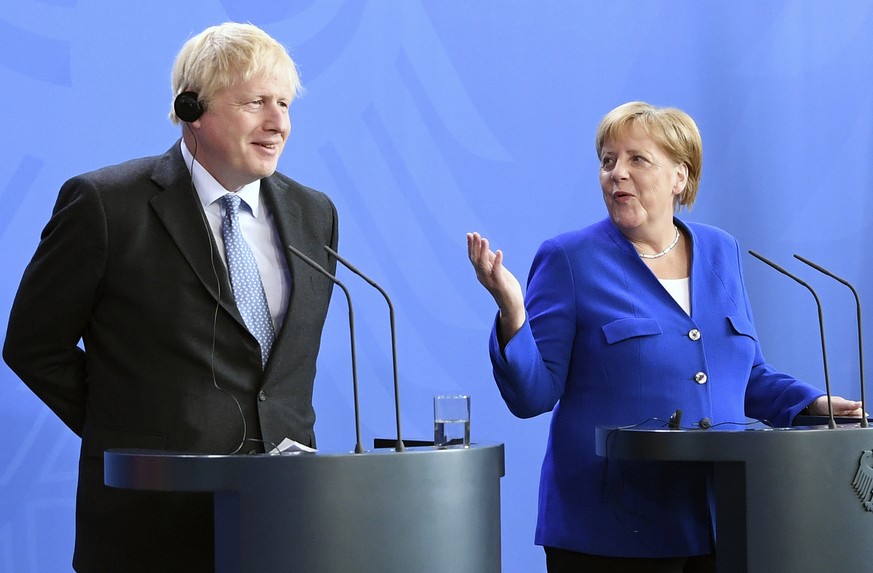 Germany&#039;s Chancellor Angela Merkel and British Prime Minister Boris Johnson attend a joint press conference, in Berlin, Wednesday, Aug. 21, 2019. German Chancellor Angela Merkel says she plans to ...