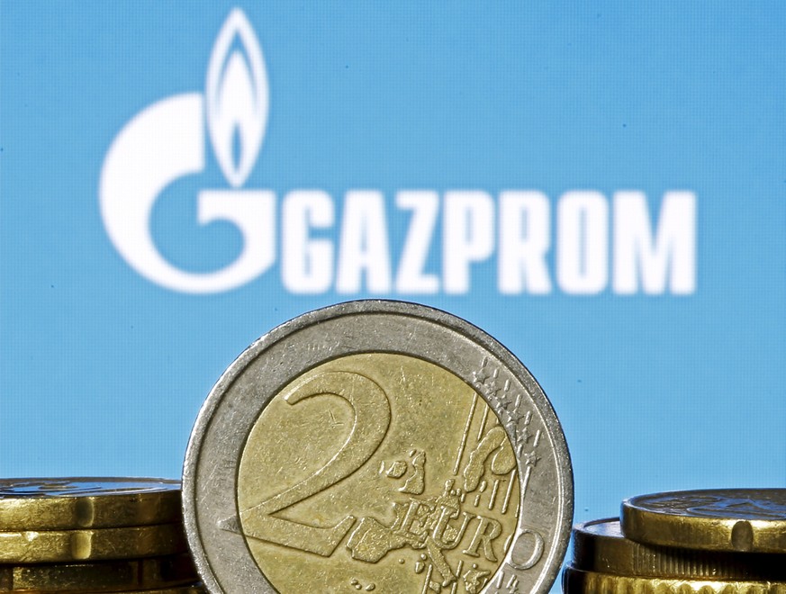 Euro coins are seen in front of displayed logo of Gazprom in this picture illustration taken in Zenica, April 21, 2015. The European Union will launch a legal attack on Russian gas giant Gazprom this  ...